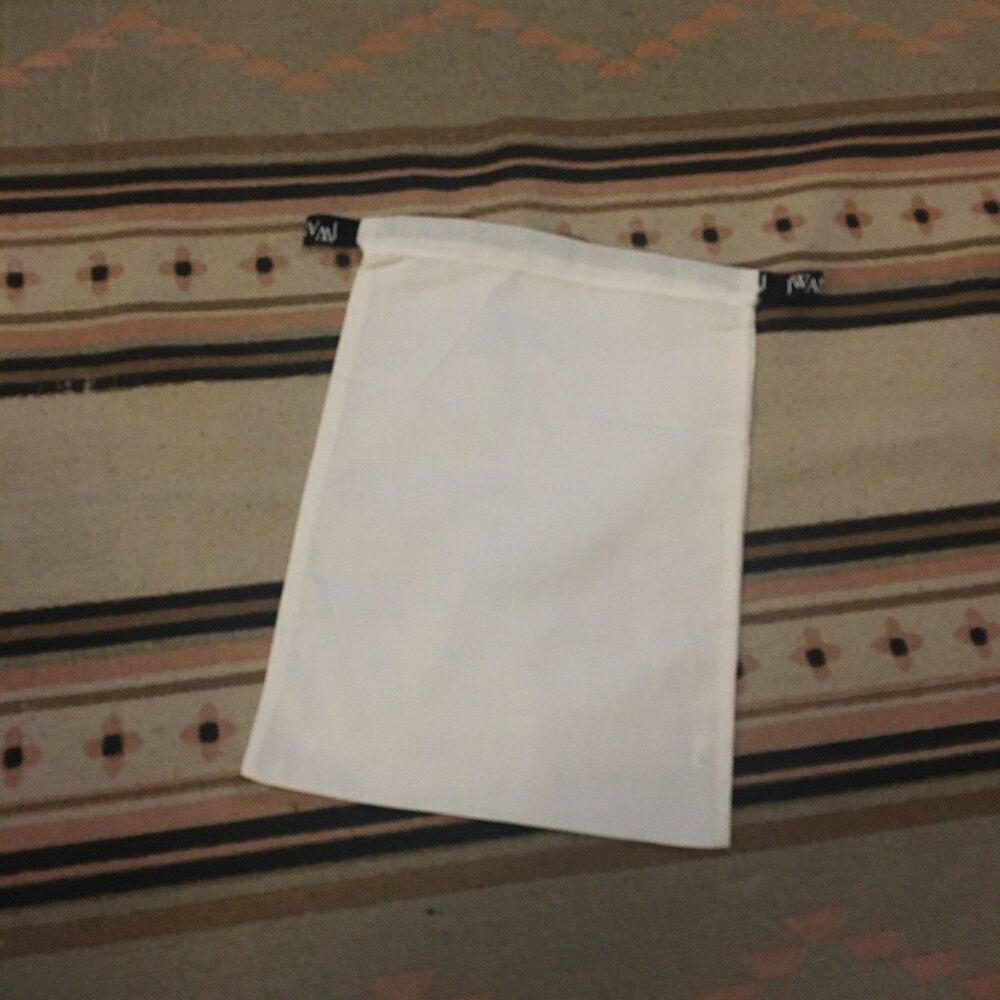 J.W. Anderson White w/ Black drawstring ribbon & logo in white 11” x 15”